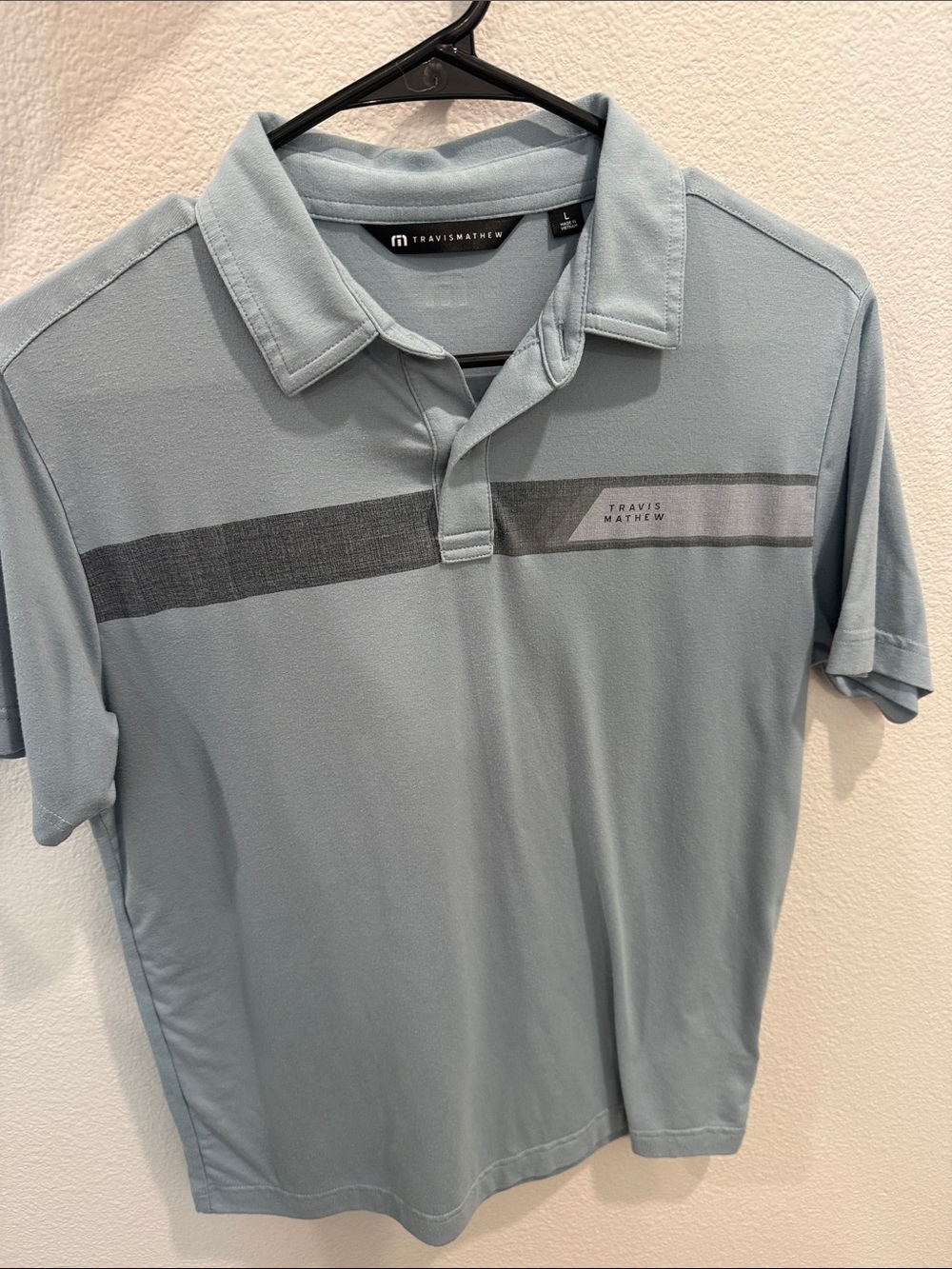 Travis Mathew Pale Blue Polo with Horizontal Slate Stripe